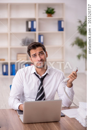 Young male employee working in the office 101520737