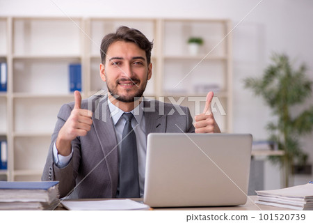 Young male employee working in the office Young male employee working in the office 101520739