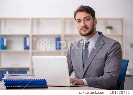 Young male employee working in the office 101520751