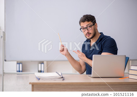 Young male teacher in telestudying concept 101521116