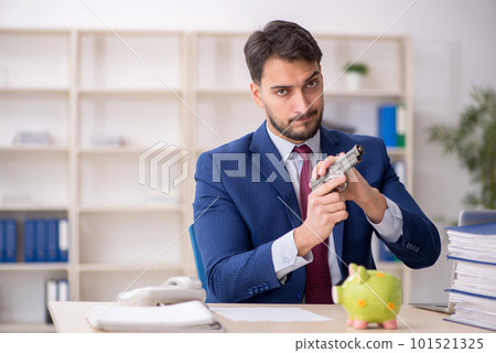 Young male employee in planning retirement concept Young male employee in planning retirement concept 101521325