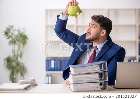 Young male employee in planning retirement concept Young male employee in planning retirement concept 101521327