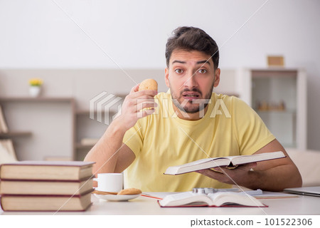 Young male student studying at home Young male student studying at home 101522306