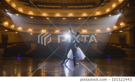 Classical ballet dancers practice on theatre stage Classical ballet dancers practice on theatre stage 101522443