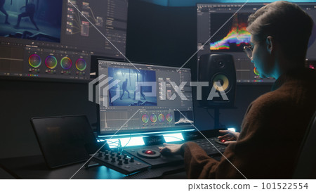 Female editor makes movie color grading using PC program 101522554
