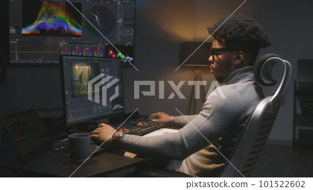African American film maker work in modern studio. African American film maker work in modern studio. 101522602