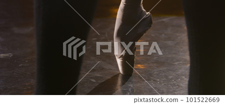 Close up leg of ballerina in pointe shoes spinning on tiptoe Close up leg of ballerina in pointe shoes spinning on tiptoe 101522669