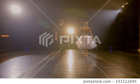 Ballet dancers come out from behind curtains and dance Ballet dancers come out from behind curtains and dance 101522695