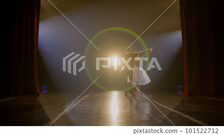Ballet dancers practice ballet movements 101522712