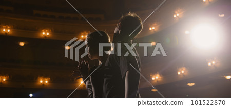 Ballerina talks about choreography with dance partner 101522870