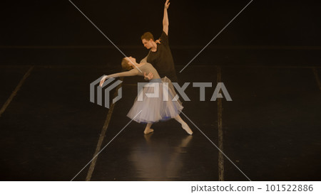 Ballet dancers practice lifts and spinning ballet movements 101522886