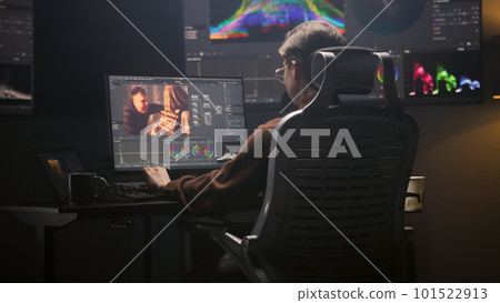 Female editor works in modern studio on PC 101522913