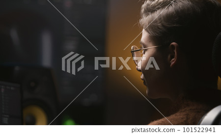 Young woman edits photo or develops design on PC 101522941