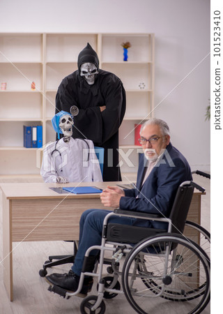 Old patient in wheel-chair visiting two devil doctors Old patient in wheel-chair visiting two devil doctors 101523410
