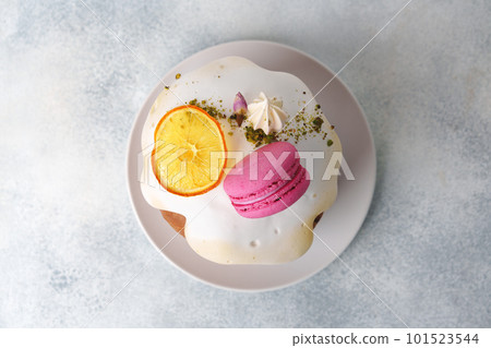Beautiful Easter cake decorated with macarons cookie and dry orange piece Beautiful Easter cake decorated with macarons cookie and dry orange piece 101523544