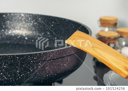 Frying pan on the gas stove in a kitchen Frying pan on the gas stove in a kitchen 101524256