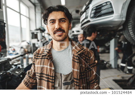 Portrait of a male mechanic in an auto repair shop 101524484