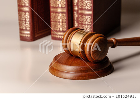 Judge gavel and legal book close up on table Judge gavel and legal book close up on table 101524915