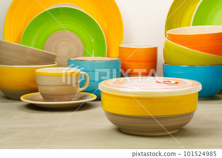 Set of colored ceramic dishware front view Set of colored ceramic dishware front view 101524985