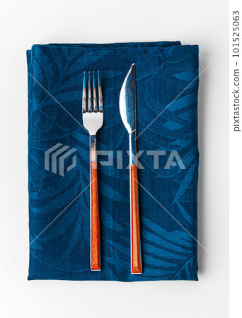 Set of fork and knife on towel. Isolated on white background. Set of fork and knife on towel. Isolated on white background. 101525063