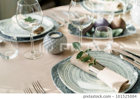 Luxury table setting for dining in pastel colors close up Luxury table setting for dining in pastel colors close up 101525084