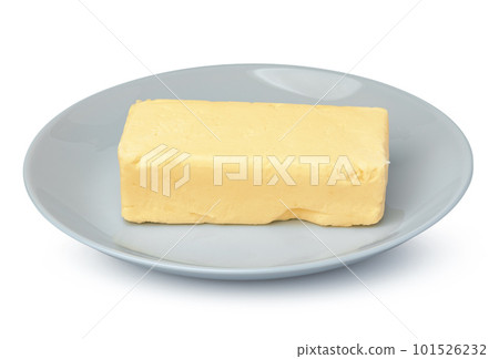 Butter on white plate isolated on white background 101526232