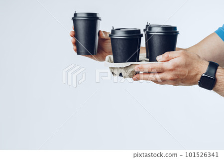 Courier hands giving packed food delivery close up Courier hands giving packed food delivery close up 101526341
