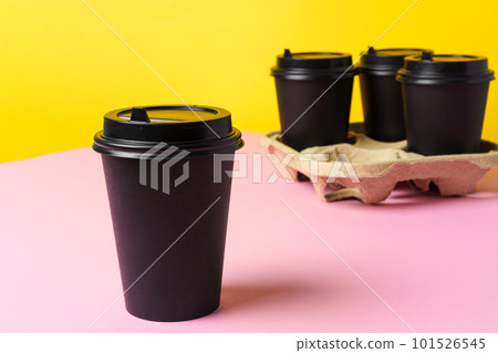 Black take away coffee cups in holder Black take away coffee cups in holder 101526545