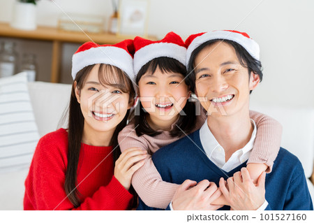young family at christmas young family at christmas 101527160