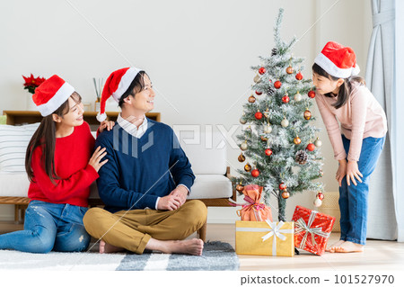A young family enjoying Christmas 101527970