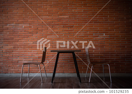 Balcony with red brick wall and table chairs set Balcony with red brick wall and table chairs set 101529235