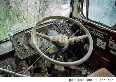 Driver's seat of a rotting bus Driver's seat of a rotting bus 101530357