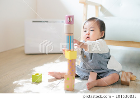 Baby playing by knocking down the stacked blocks Baby playing by knocking down the stacked blocks 101530835