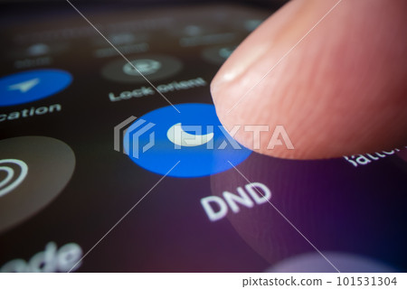 Macro shot of switching smartphone to do not disturb mode 101531304