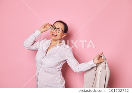 Happy pregnant joyfully smiling woman in stylish eyeglasses, looking at camera isolated against pink color background. Successful entrepreneur, manager, office worker waiting for maternity leave 101532752
