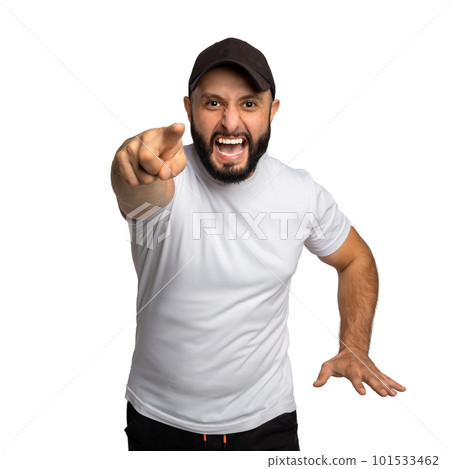 Portrait of peevish bearded guy with black hat, yells angrily at somebody, points with index finger directly at camera 101533462