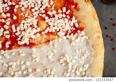 Closeup on raw pizza base with sauces Closeup on raw pizza base with sauces 101533687