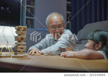 Happy grandparents Asian family enjoy playing toy block with little daughter and mother together at home night time, Smiling parent having fun play build constructor tower of wooden blocks, education Happy grandparents Asian family enjoy playing toy block with little daughter and mother together at home night time, Smiling parent having fun play build constructor tower of wooden blocks, education 101534945