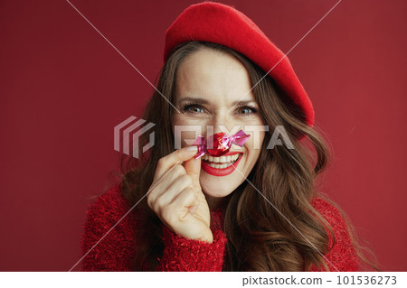 happy stylish woman in red sweater and beret 101536273