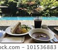 Waterside cafe surrounded by greenery 101536883