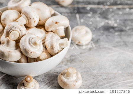 Full bowl with mushrooms on the table. 101537846