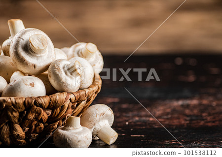 A full basket of mushrooms on the table. A full basket of mushrooms on the table. 101538112