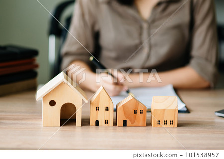 Considering buying a home, investing in real estate. Broker signs a sales agreement. agent, lease agreement, successful deal in office Considering buying a home, investing in real estate. Broker signs a sales agreement. agent, lease agreement, successful deal in office 101538957
