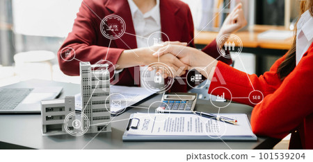 Signing a contract. Client and broker agent, lease agreement, successful deal and Young business sitting at the desk in office Signing a contract. Client and broker agent, lease agreement, successful deal and Young business sitting at the desk in office 101539204