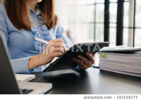 Businesswoman working with VR wide blank screen tablet, computer and smart phone on office blur background. 101539273