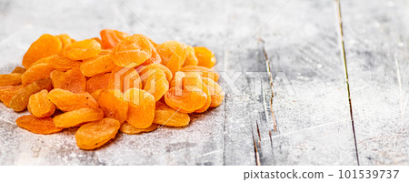 A pile of delicious dried apricots on the table. 101539737