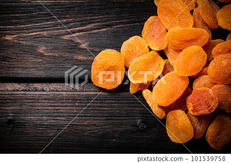 Golden delicious dried apricots on the table. Golden delicious dried apricots on the table. 101539758