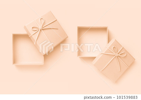 Open beige square gift box with a bow Open beige square gift box with a bow 101539883