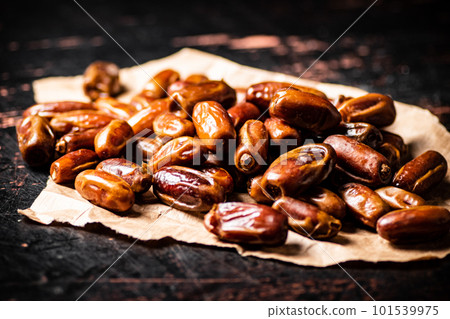 A pile of dates on paper on the table. A pile of dates on paper on the table. 101539975