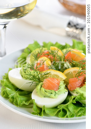 Stuffed eggs with avocado and salmon Stuffed eggs with avocado and salmon 101540005